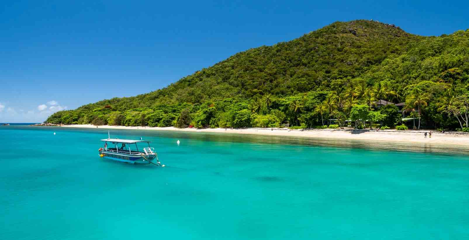 boat floating near fitzroy island beach