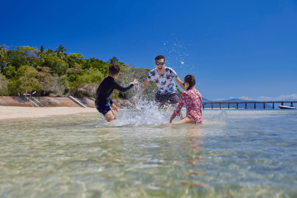Family in the water on Green Island
